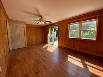 Living room that is attached to the Laundry room with washer and dryer