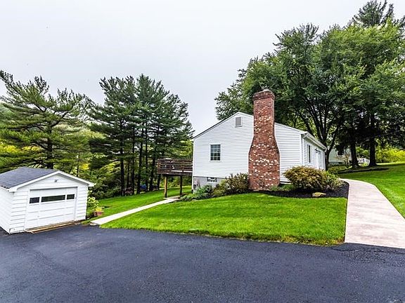 Widened, paved driveway for multiple parking spaces.