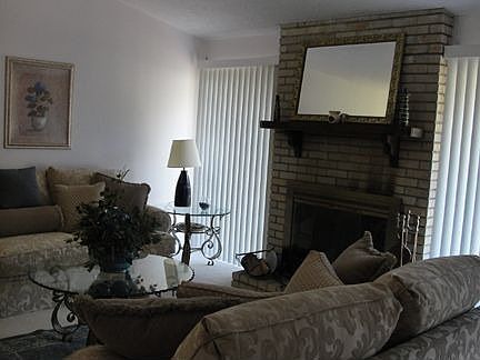 Vaulted living room w/fplc