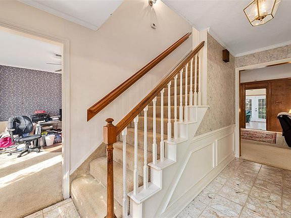 Foyer with formal living to the right and formal dining to the left.
