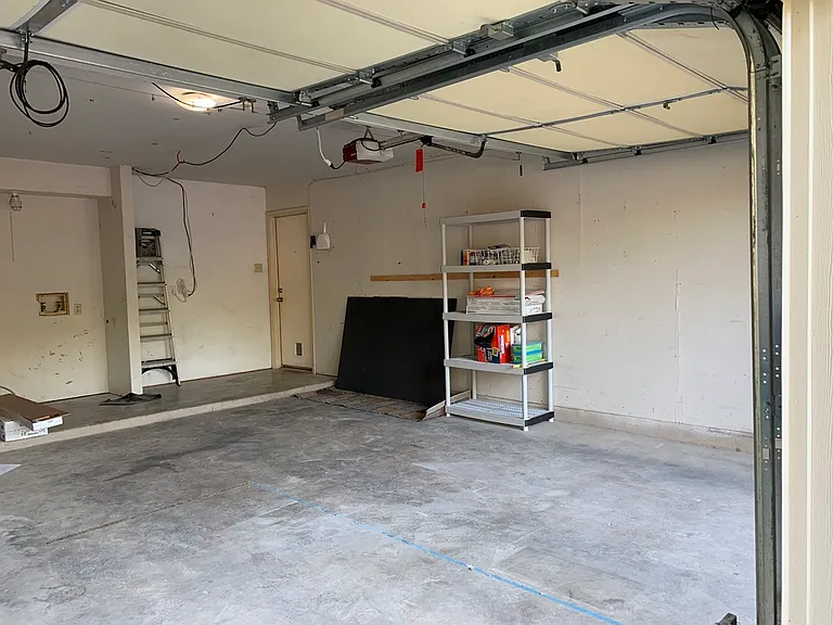 Two car garage with hookups for W/D.
