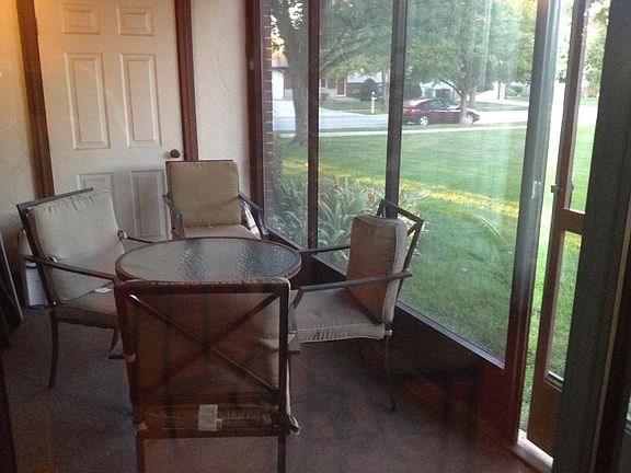screened in porch opening to courtyard