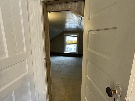 This is the "bonus room" that is off the living room. It could be a second bedroom. The ceiling is 6' high at the apex.