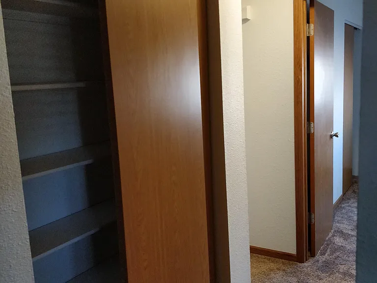 Hallway from living room to bed/bathroom with closet LEFT.