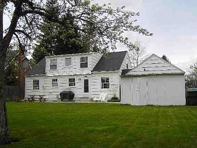 Large Backyard with shed fruit tree and Large maple tree