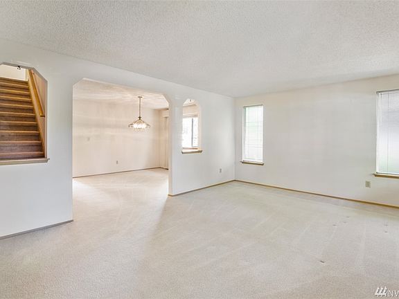 Huge Living room connecting to the formal dining area.