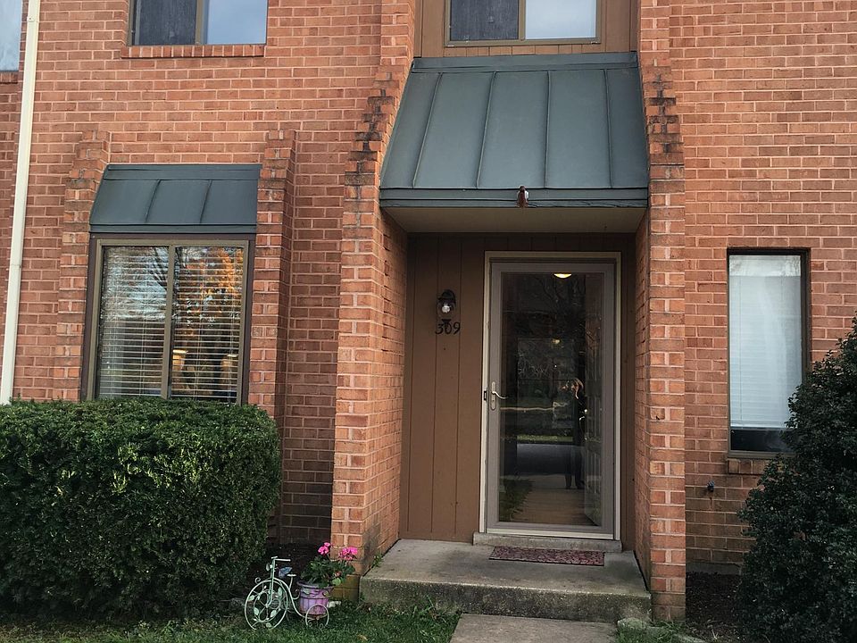 Front entrance with glass storm door
