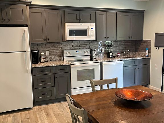 Kitchen, new cabinets, refrigerator and stove, Dishwasher is newish.