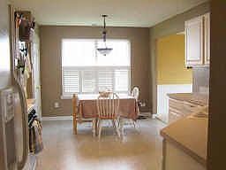 Beautiful, bright, eat in kitchen with plantation shutters and new light above