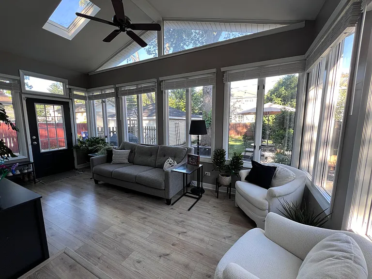 Sunroom off the kitchen. Great second living space or room for a large dining table.