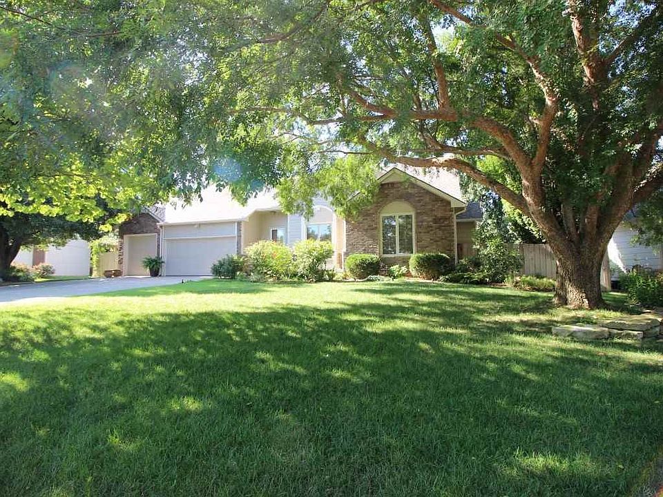 Beautifully landscaped and embedded in a setting surrounded by mature trees!