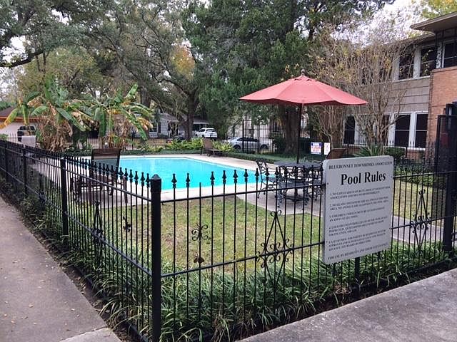 Beautiful community swimming pool with lots of greenery