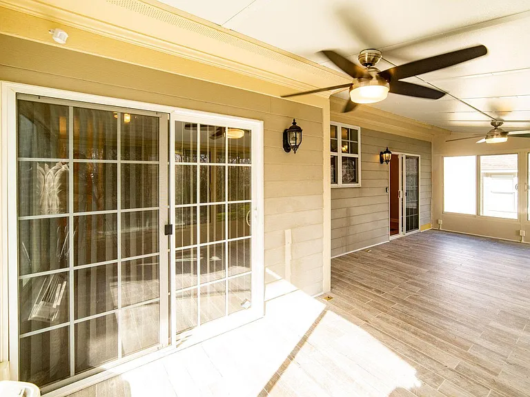 FOUR-SEASON SUNROOM WITH VIEW OF 1ST-FLOOR MAIN BEDROOM