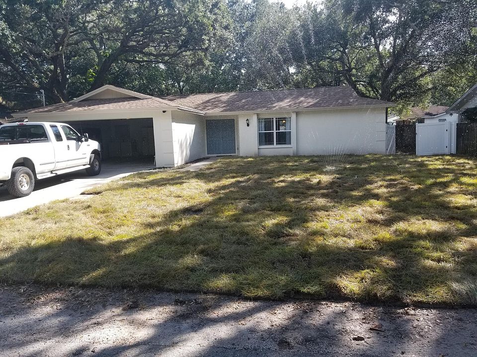 View from the front. New roof and new sod. Extra parking on left side of driveway.