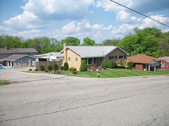 House is on a corner lot with a private Lane