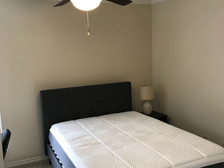 Secondary Bedroom #2, furnished with full size bed, tall dresser, desk, chair, & nightstand. Walk in closet. Private space for occupant of secondary bedroom #2.