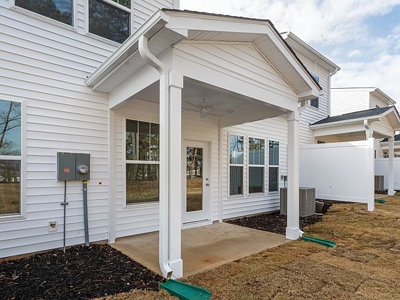 2 Story townhome, white and grey, 1 car garage