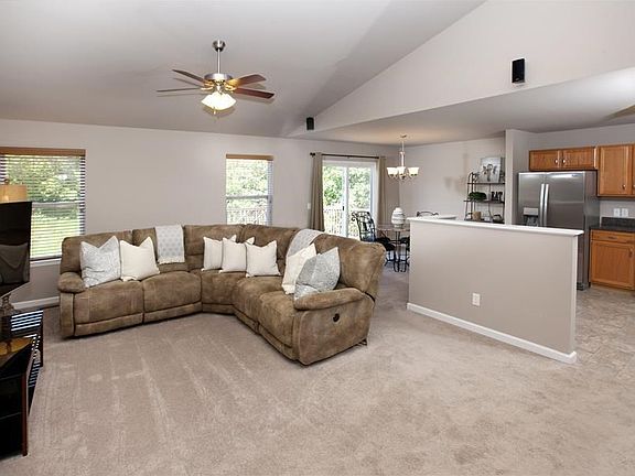 Light and bright great room with vaulted ceiling and awesome open floor plan.  Neutral paint color flows throughout the home.