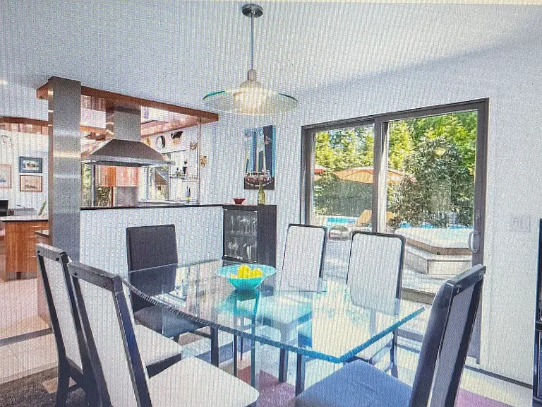 Dining area with sliding doors to backyard and Hot Tub