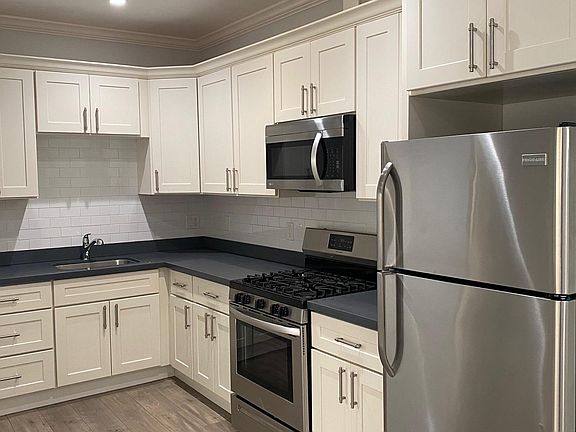 White Shaker Cabinets, Quartz Counters, Stainless Steel Appliances