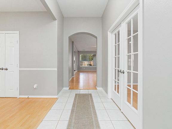 Tiled entry with French doors that lead to office / den / flex space.