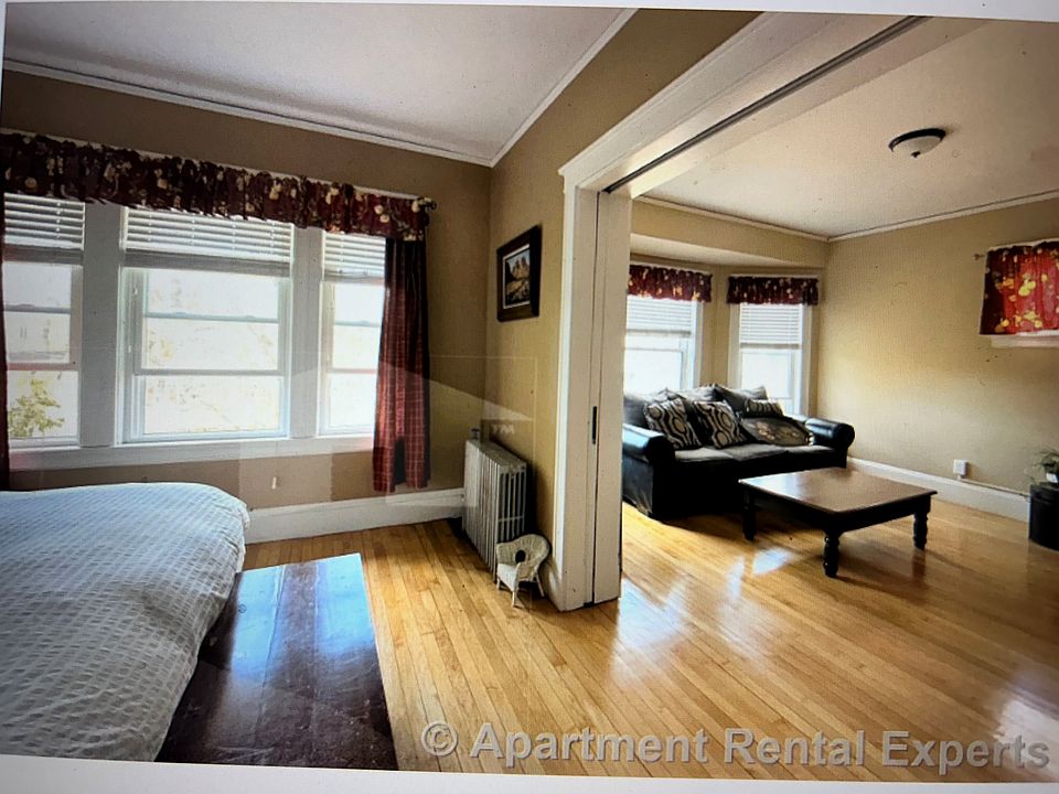 Front bedroom, living room. Sliding doors separate them.