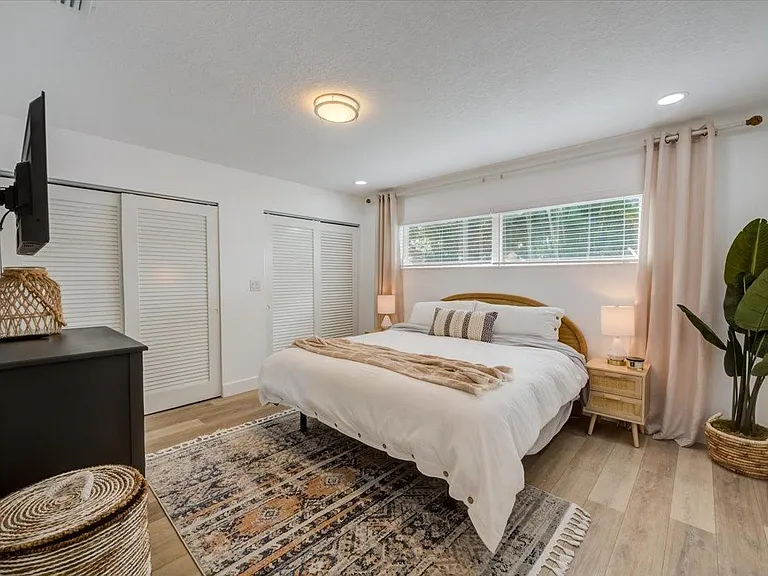 Master bedroom. Extremely comfortable King bed. Adjustable bed remote. Lux sheets, comforter, pillows. Double Closet.
