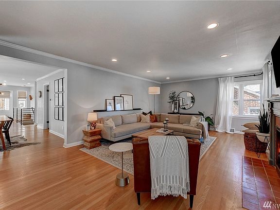 The home greets you with the living room that opens into the dining and kitchen area.