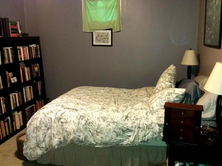Bedroom with dressing area, private bath and door to backyard
