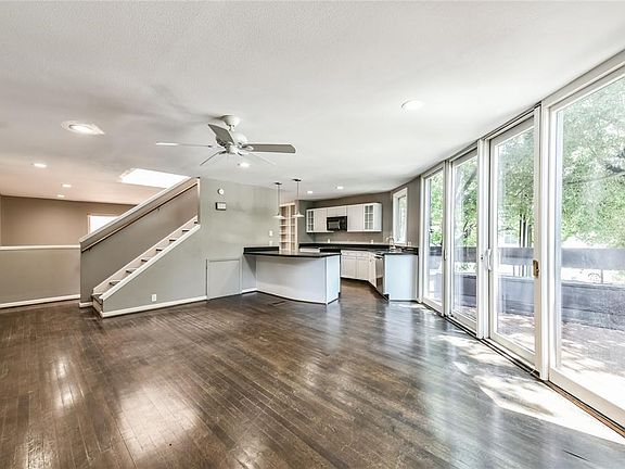 This sitting room was the most popular place to relax looking out on the deck and beautiful mature tree.