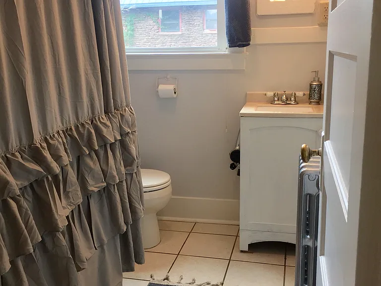 Bathroom with soaking tub with shower