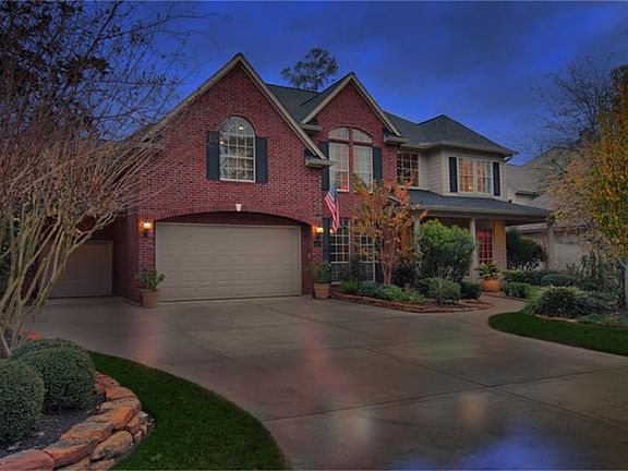 Features wide driveway with true 3-car garage plus workshop.