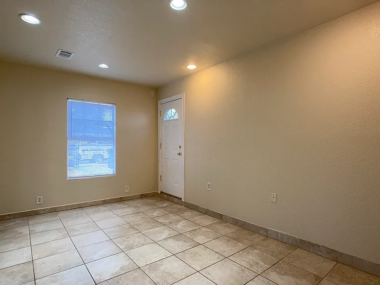 Extra room, opposite view. Door in back to outside near driveway