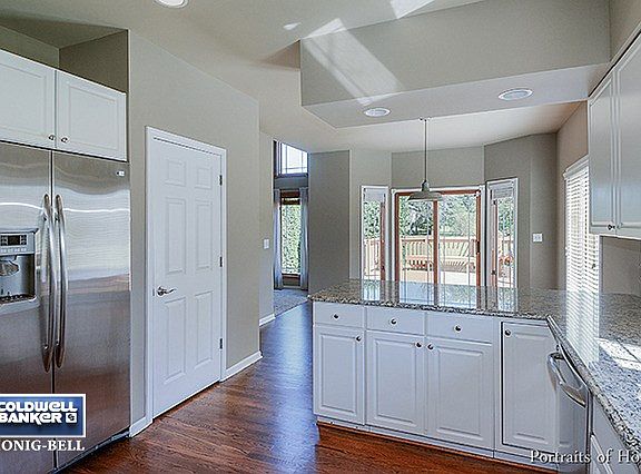 Includes closet pantry and granite countertop overhang for barstool seating.  Great view into yard.