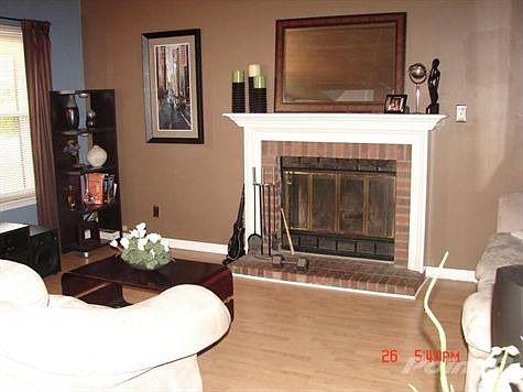The entire downstairs is bright and open, featuring a cozy fireplace, with new hardwood lamnates, fr