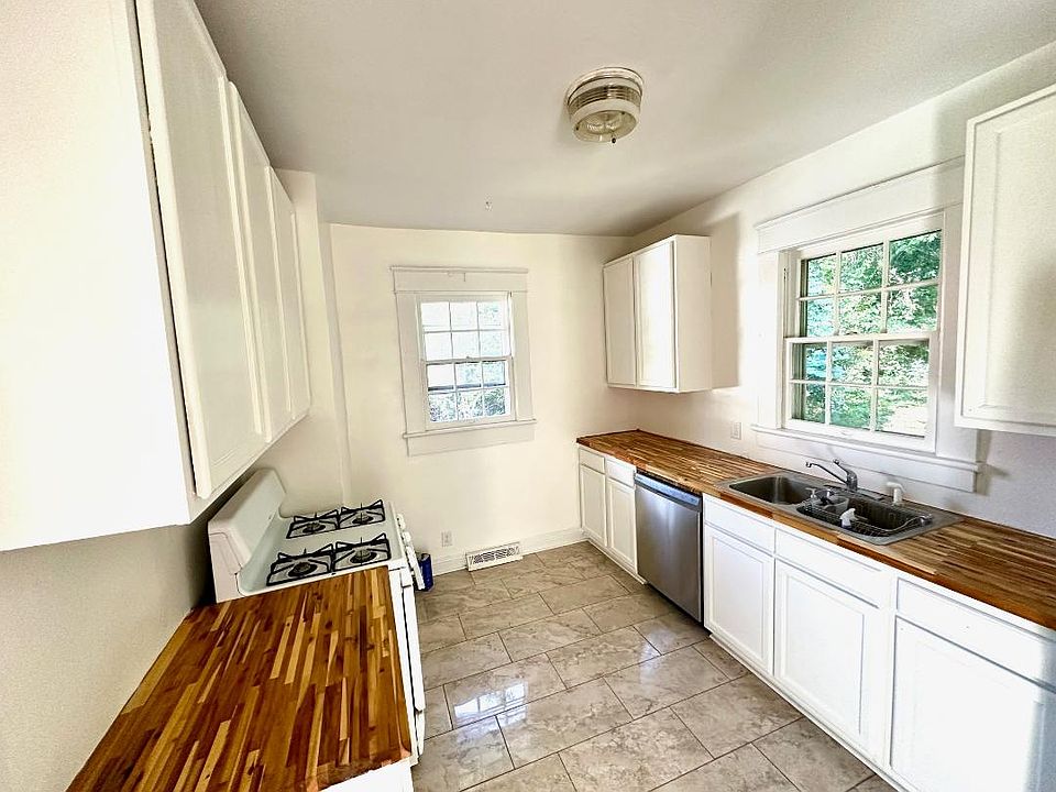 kitchen with real butcher block and tile flooring