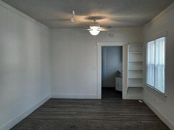 Large living/dining room with doorway into kitchen