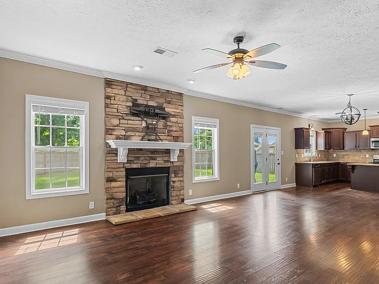 Open-concept living space with fully functional fireplace and lots of room