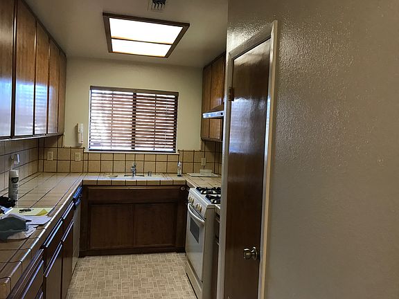 Tile counters, lots of cabinets