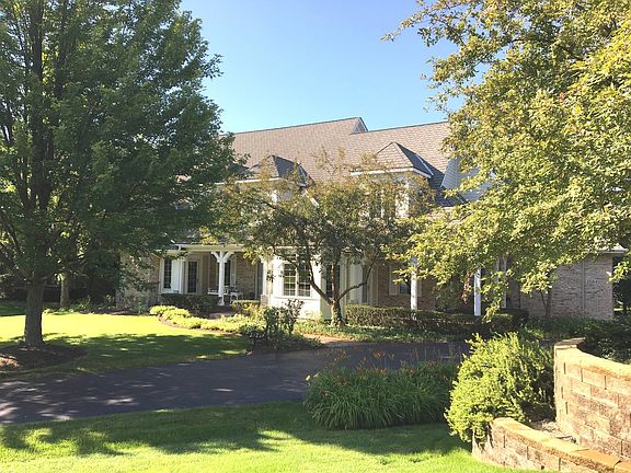 Imagine living here...welcoming front porch and side porch to dine al fresco. Double wide rear yard cul de sac location.