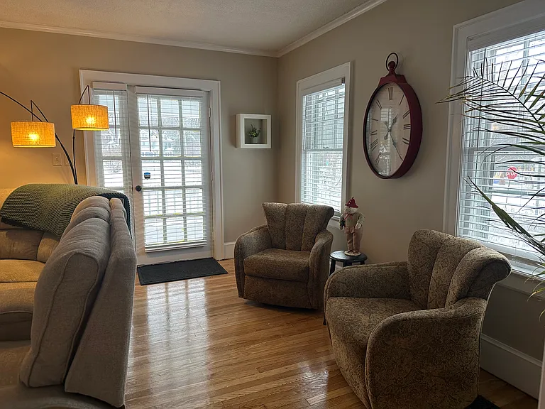 refinished floors lead to 2nd living room and covered outdoor porch! Lots of couches and seating, all freshly cleaned