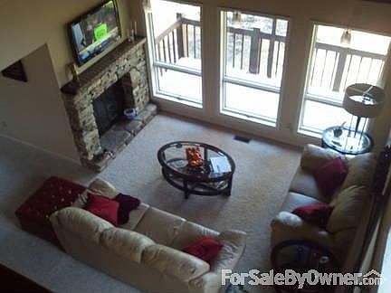 Open Concept Floor Plan
						:
						View from second floor catwalk of living room and dining room area & fire place