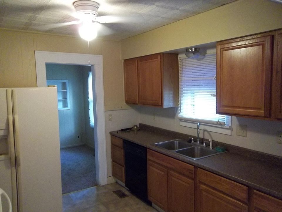 Updated kitchen cabinet with dishwasher, stove and refrig