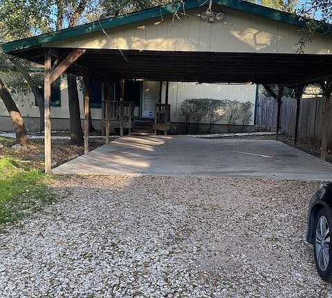 2-car carport, security lighting and fenced Boat/RV storage to right of carport.