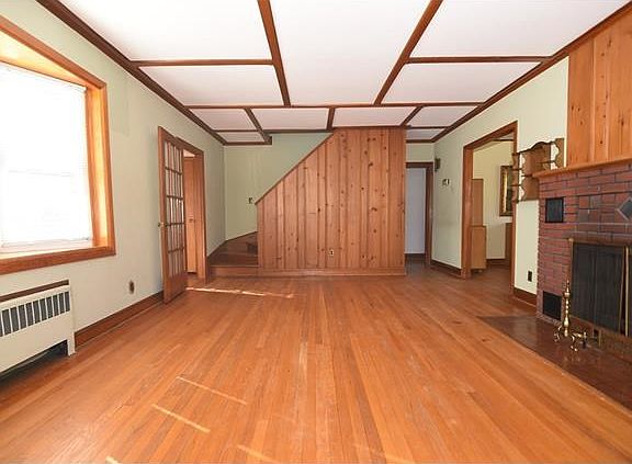 Another view of the living looking towards the staircase to the second level which is unfinished and waiting for you to bring your ideas for the expansion this home.