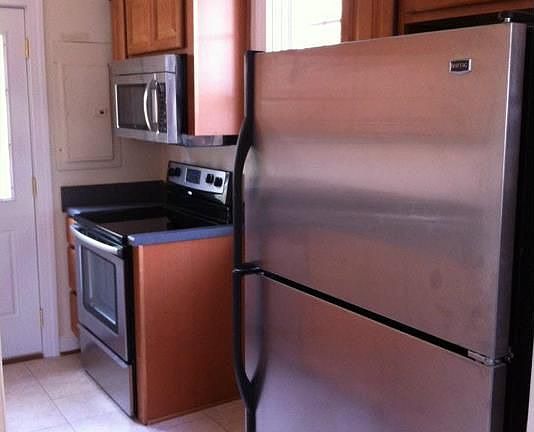 Kitchen with ceramic tile floor, new cabinets and stainless appliances