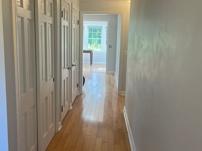 Hallway from front door through to sunporch area. Plenty of extra closet space