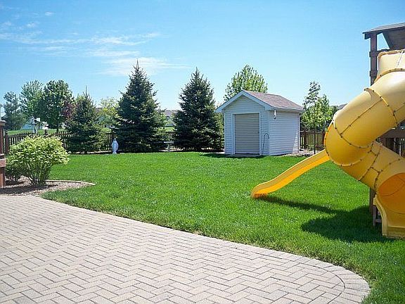 View of backyard and paver patio