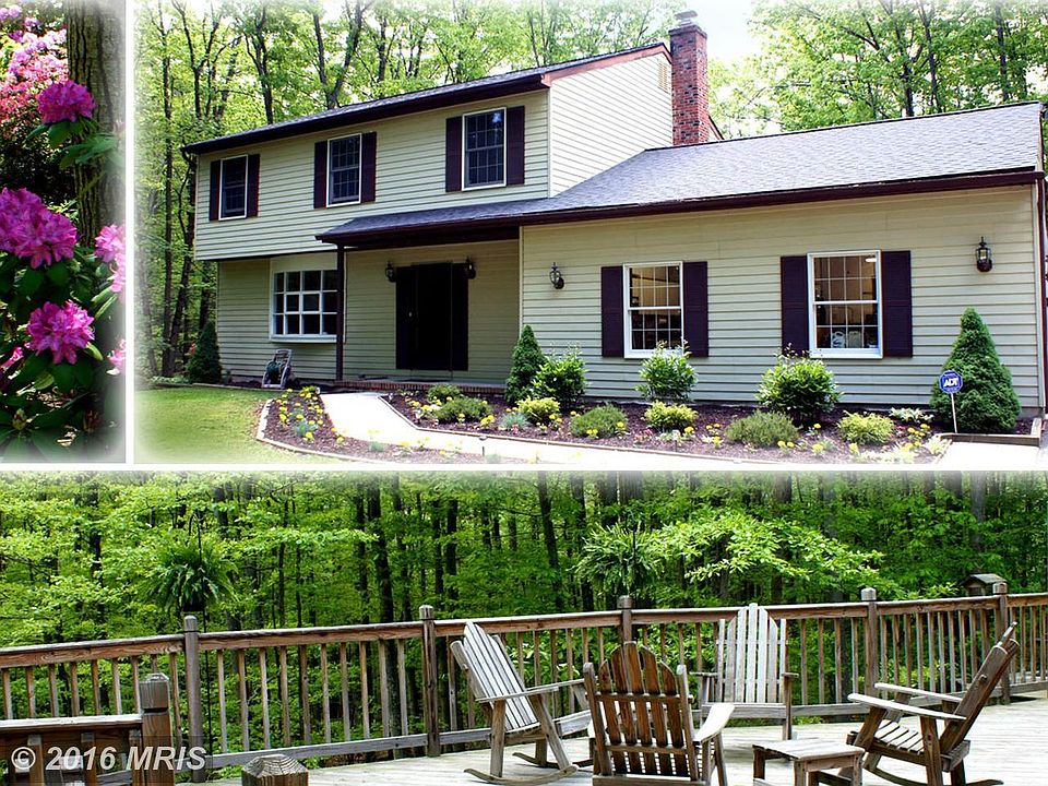 Charming Colonial Nestled in Verdant Woodland