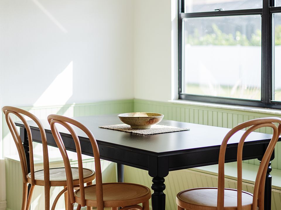 Kitchen table that is expandable to fit 8 people. The corner bench sections lift up and serve as extra storage space.